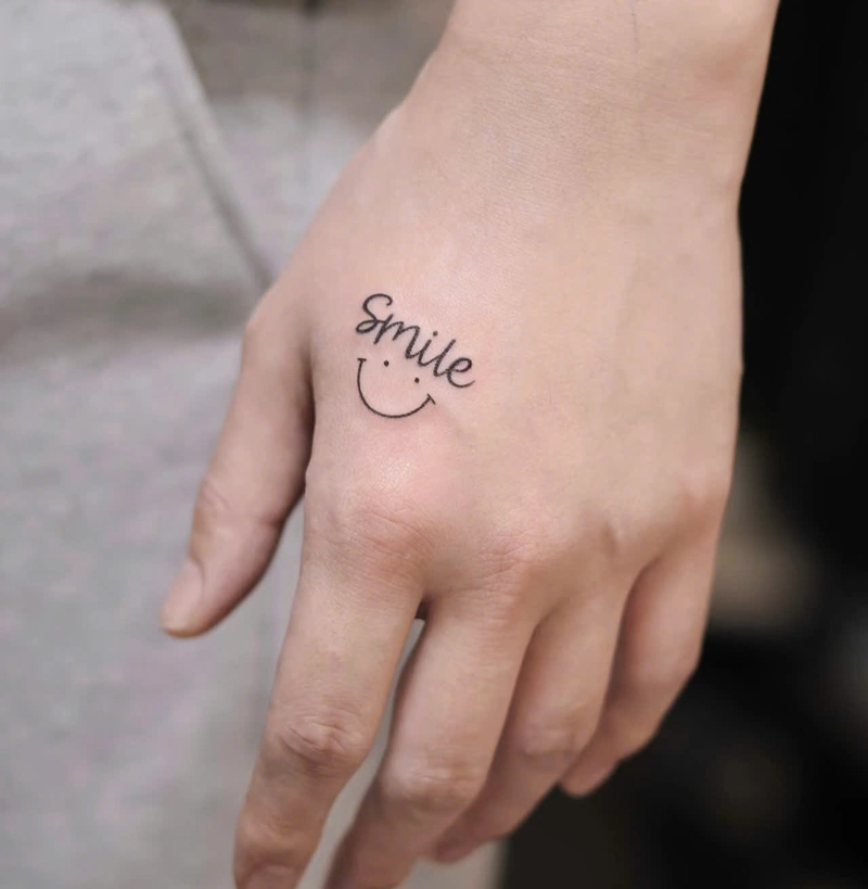 hình xăm mặt cười smile