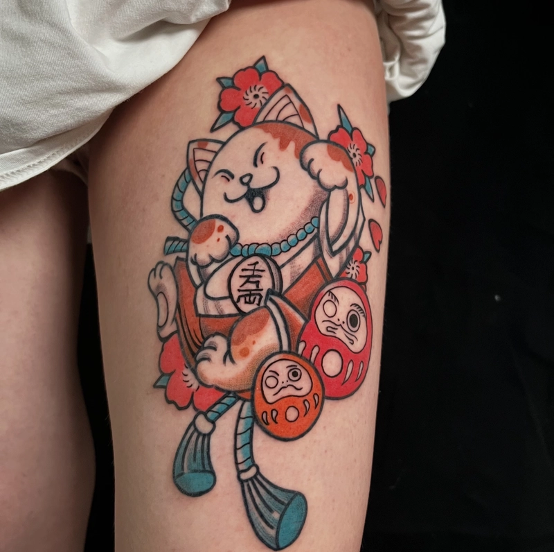 hình xăm mèo thần tài và daruma