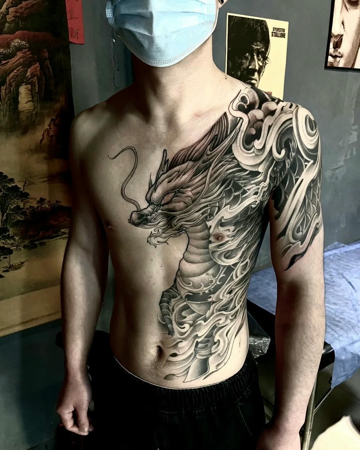 Xăm hình kỳ lân rồng kín tay và ngực uy nghiêm