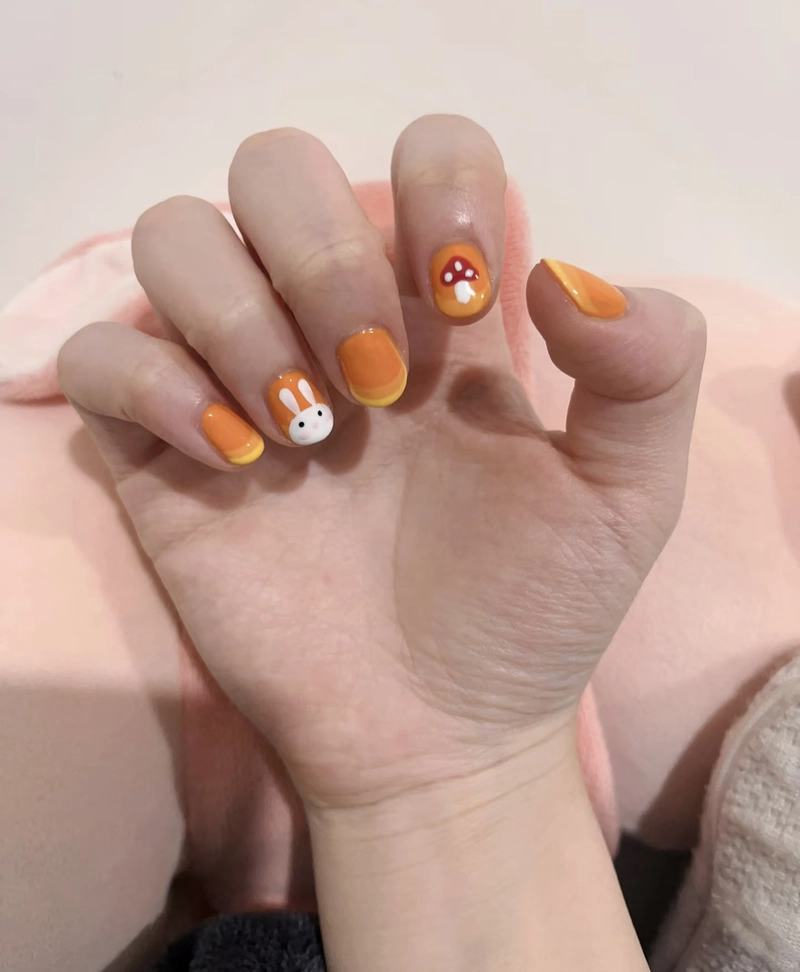 mẫu nail màu cam cho bé