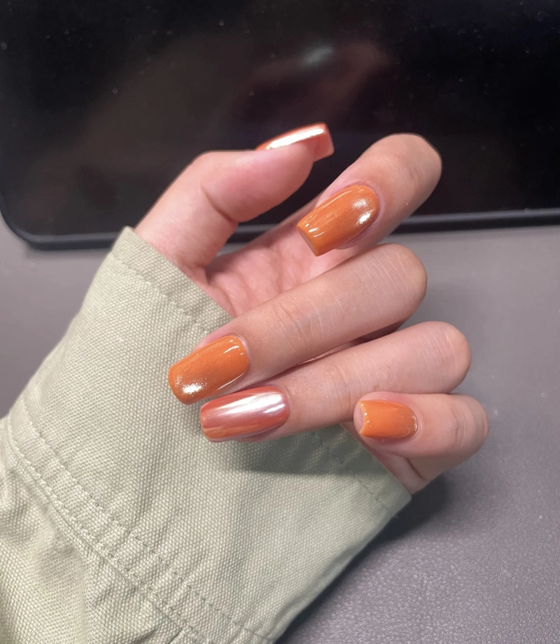 mẫu nail màu cam mắt mèo