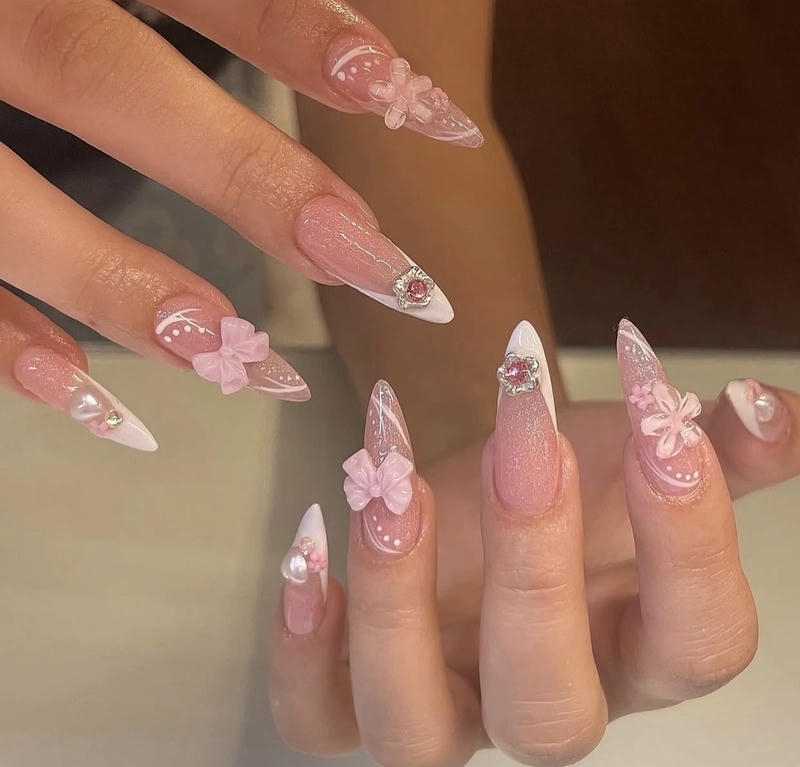 mẫu nail màu hồng phấn gắn nơ