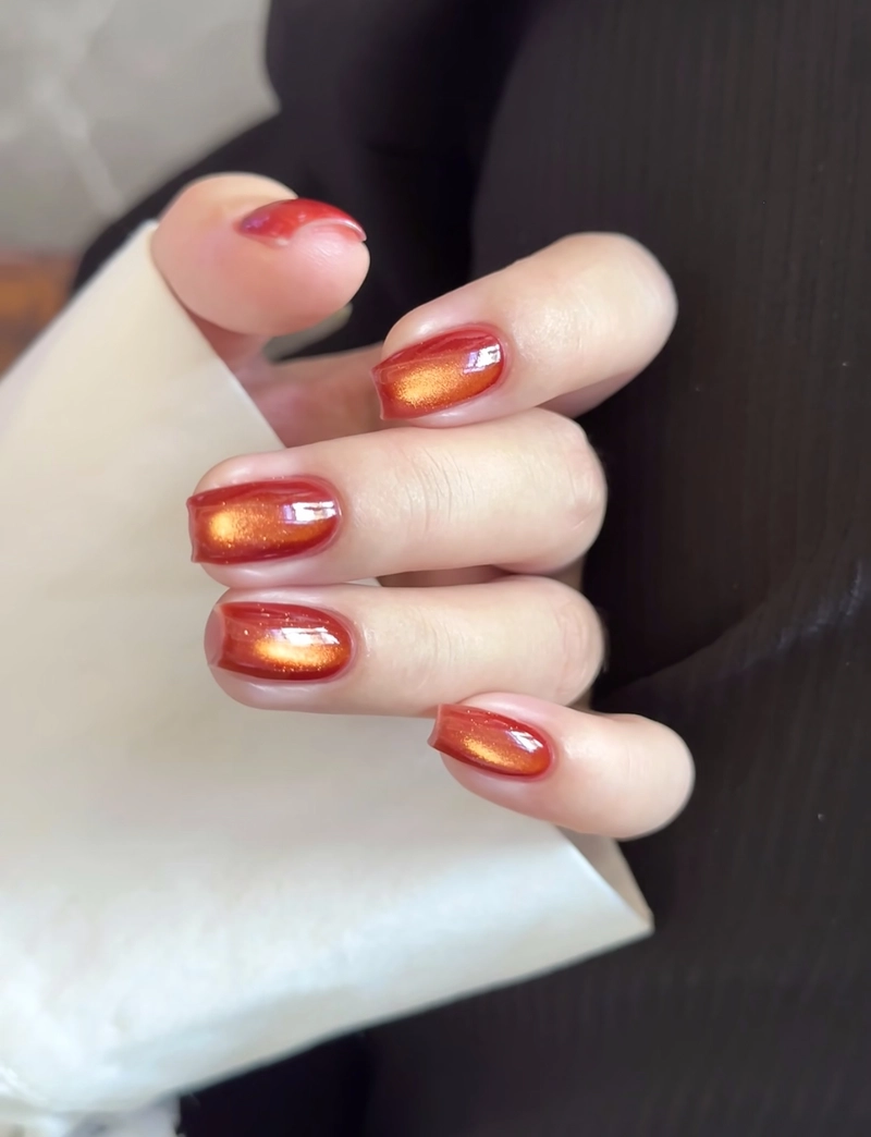 nail màu cam mắt mèo