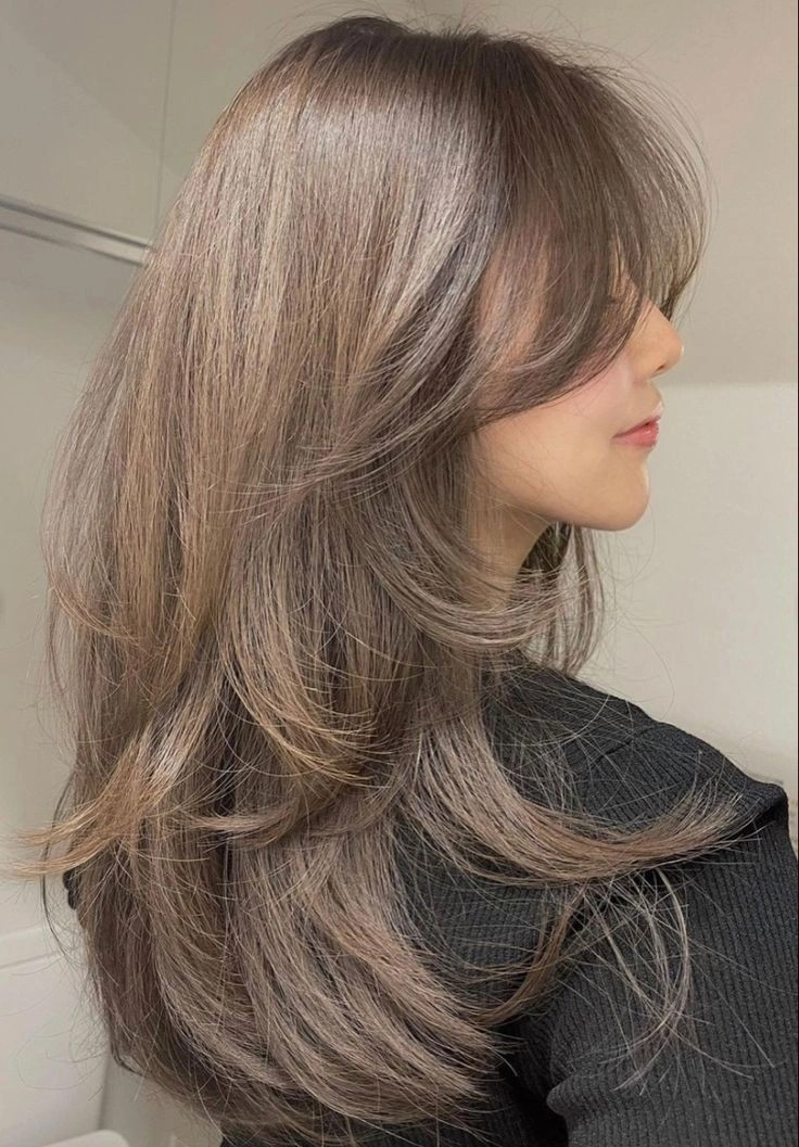 tóc layer xoăn cụp đuôi