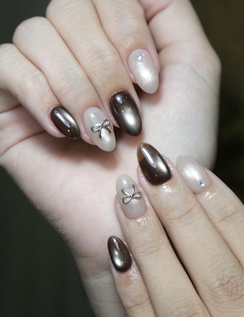 Mẫu nail mắt mèo lấp lánh vẽ nơ