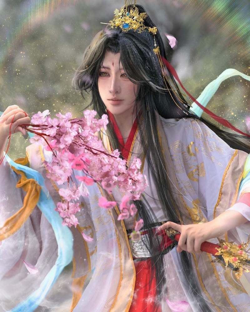 Hình ảnh cosplay nam cổ trang cầm hoa đào hồng đẹp